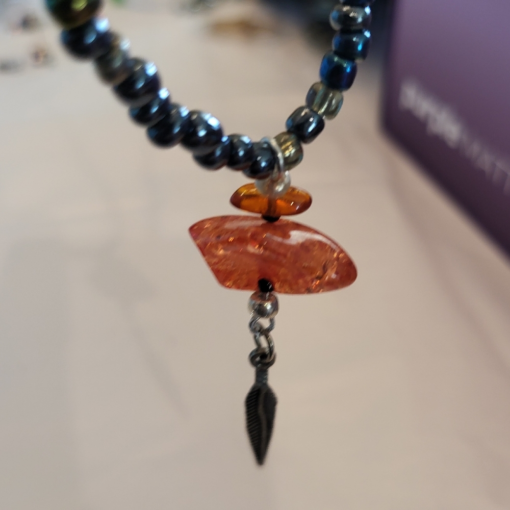 Orange and Iridescent Stretch Necklace with Silver Feather